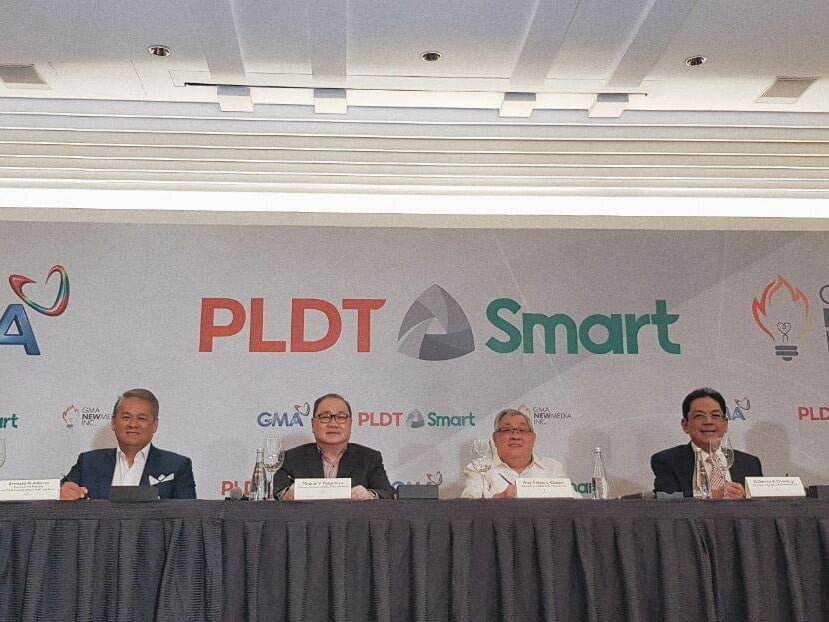 PLDT SVP and Head of Consumer Business–Market Development Oscar Enrico A. Reyes, PLDT EVP and Chief Revenue Officer Ernesto R. Alberto, PLDT and Smart Chairman and CEO Manuel V. Pangilinan, GMA Network Chairman and CEO Felipe L. Gozon, GMA Network President and COO Gilberto R. Duavit, Jr., and NMI President and COO Judd Gallares during the signing ceremony of the GMA-PLDT partnership in Makati City on January 9, 2019.